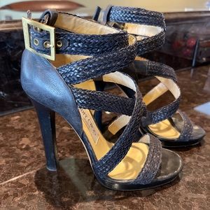 Jimmy Choo black straps woven stilettos.